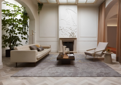 Desso Art Deco vloerkleed in grijstinten in woonkamer met visgraatvloer